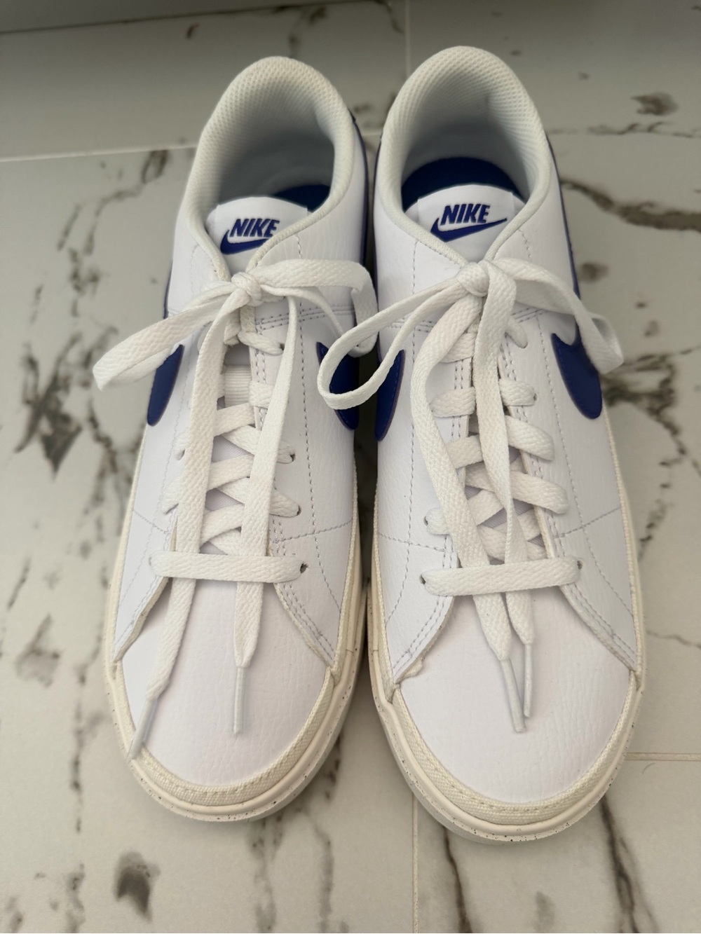 Nike White Low-Top Sneakers with Blue Swoosh